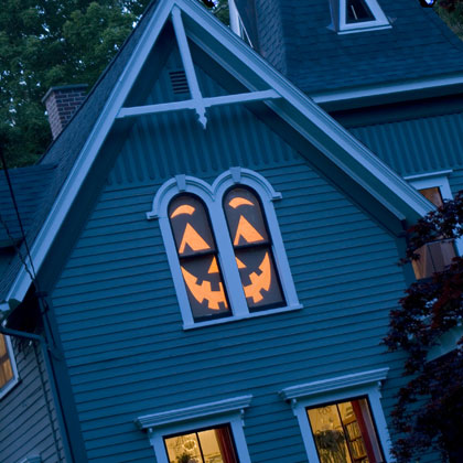 Pumpkin Faces on windows for Halloween.